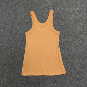 Close-up of ginger yellow ribbed cotton tank top showing texture and round neckline