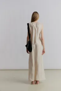 Detail of elegant satin maxi skirt back view with minimalist elastic drawstring waist
