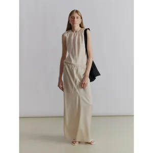 Minimalist beige satin skirt set with sleeveless top and drawstring long A-line skirt