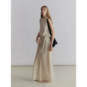 Minimalist champagne satin sleeveless A-line maxi dress with adjustable drawstring waist