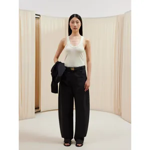 Minimalist cream cotton U-neck tank top with black wide-leg trousers and belt for women