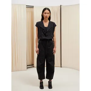 Minimalist black short-sleeve shirt and matching trousers set with draped collar detail