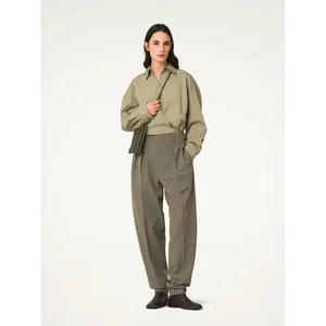 Minimalist olive cotton wrap shirt with irregular lapels and high waist wide leg pants