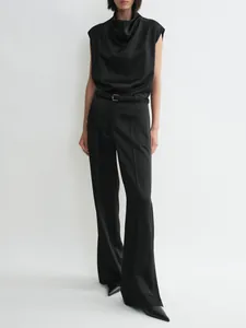 Detail view of black satin sleeveless cowl neck top with matching high-waisted wide-leg trousers