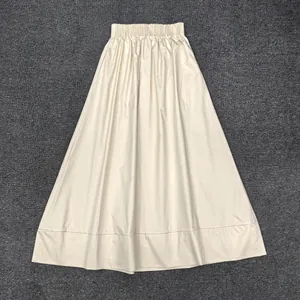 Detail of high-waist cotton A-line skirt with elastic waistband and wide hem stitching
