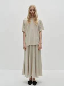 Full view of casual beige knit two-piece set with short sleeve t-shirt and maxi skirt