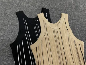 Close-up of ribbed knit texture on striped sleeveless tank tops in black and beige