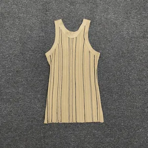 Close-up of khaki ribbed knit tank top with black vertical stripes laid flat on fabric