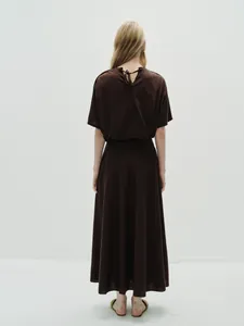 Rear view of long dark coffee A-line skirt set with elegant back neck tie detail