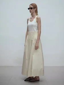 Minimalist elastic high waist cotton A-line maxi skirt with sleeveless white vest