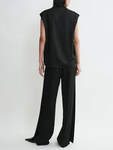 Minimalist black sleeveless top with relaxed drape neck and high-end satin texture