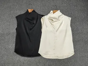 Detail of elegant satin sleeveless tops with high cowl neck design in black and beige