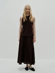 Minimalist coffee brown high-waist maxi skirt set with elegant draped fabric texture