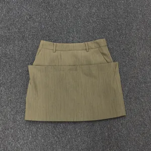 Detail view of khaki A-line mini skirt with double-layered front and waist belt loops