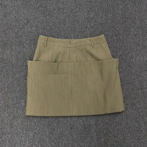 Detail of olive green A-line skirt with vertical texture and invisible back zipper