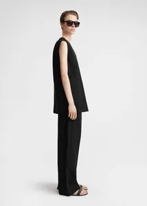 Minimalist black sleeveless top and wide-leg trousers set with a relaxed silhouette