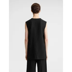 Minimalist black sleeveless long top with V-neck and split hem, casual business style