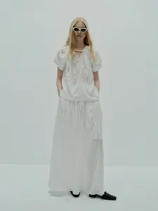 Minimalist white textured pleated short sleeve top and matching long skirt two-piece set