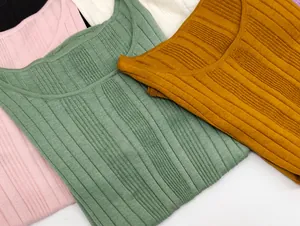 Detailed view of colorful ribbed knit short sleeve tops in various fashion colors