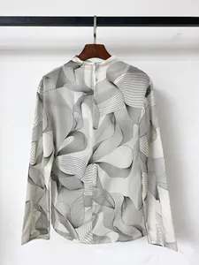Detail of artistic black and white wavy print fabric and invisible zipper on the back