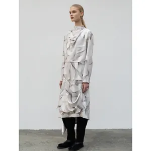 Women's two-piece set featuring draped long sleeve print top and asymmetric skirt ensemble