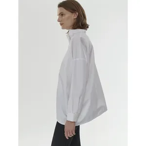 Minimalist white oversized long sleeve shirt with retro stand collar and drop shoulders
