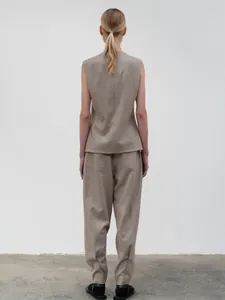 Rear view of light brown sleeveless vest and matching wide-leg trousers suit set