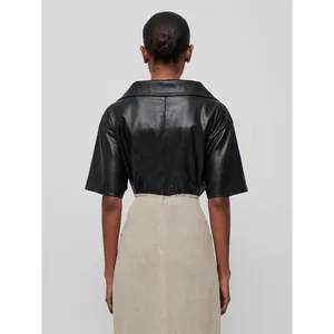 Women's black faux leather short sleeve shirt with knotted V-neck and back seam detail