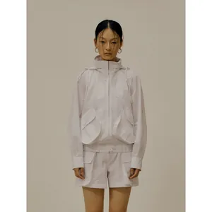 Minimalist white hooded jacket with large pockets and matching utility shorts set