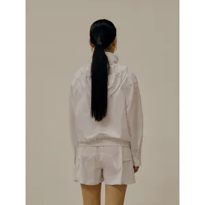 Minimalist white hooded jacket and shorts set with large utility pockets for women