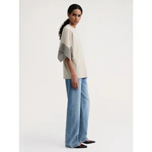 Minimalist beige striped short sleeve T-shirt with light blue wide leg jeans