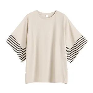 Minimalist oversized off-white T-shirt with black geometric stripes on wide short sleeves