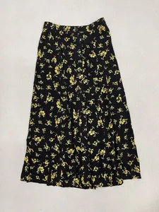 Detailed flat lay of high-waist floral midi skirt with single-breasted button front