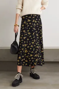 Floral midi skirt with front buttons styled with white sweater and black leather handbag