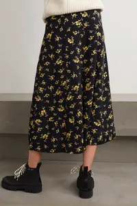 Detail of high waist black floral midi skirt with yellow print and elegant A-line drape
