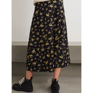 Floral midi skirt with yellow flowers on black fabric and front buttons for women