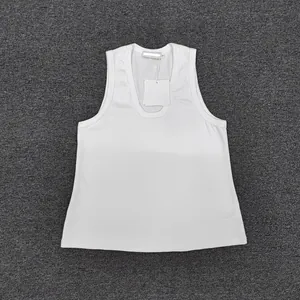 Detailed flat lay of a white cotton tank top with U-neck design and size S tag