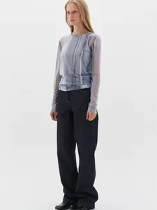 Detail of grey-blue semi-sheer mesh top with tie-dye texture and casual slim-fit crew neck
