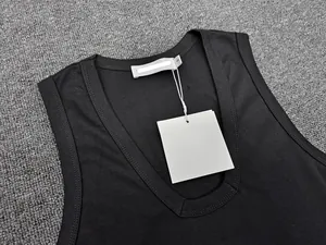Detail view of the deep U-neckline and stitching on a black sleeveless casual vest