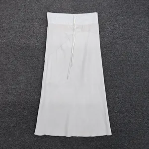 Detail of light grey midi skirt featuring adjustable drawstring waist and diagonal stitching