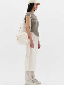 Macro detail of drawstring midi skirt with elastic waist and minimalist texture