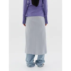 Light blue drawstring midi skirt with back seam detail paired with a purple shirt