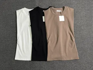 Close-up of minimalist crew neck muscle tanks in white, black and coffee cotton fabric
