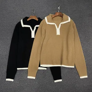 Detail of V-neck polo collar and contrast stripe knit texture in black and khaki colors