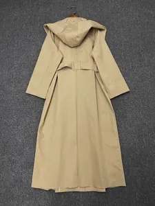 Rear view of long khaki hooded trench coat with matching belt and sleek tailored cut