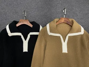 Detailed view of contrasting white edge on thick ribbed knit long sleeve polo shirts
