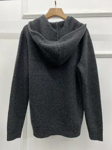 Back view of thick dark grey knitted hoodie with ribbed cuffs and minimalist design