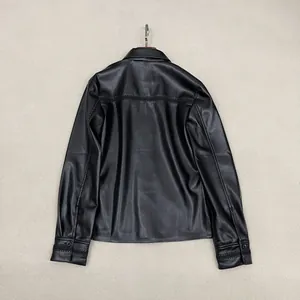 Back view of black faux leather shirt jacket with lapel collar and horizontal stitching