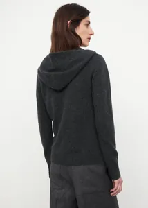 Detail of dark grey hooded knit sweater showing fine texture and ribbed cuffs
