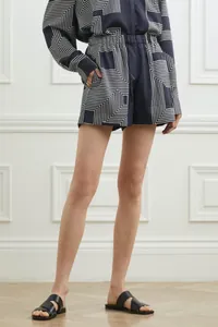 Detail of satin geometric print two-piece set with loose shirt and elastic shorts